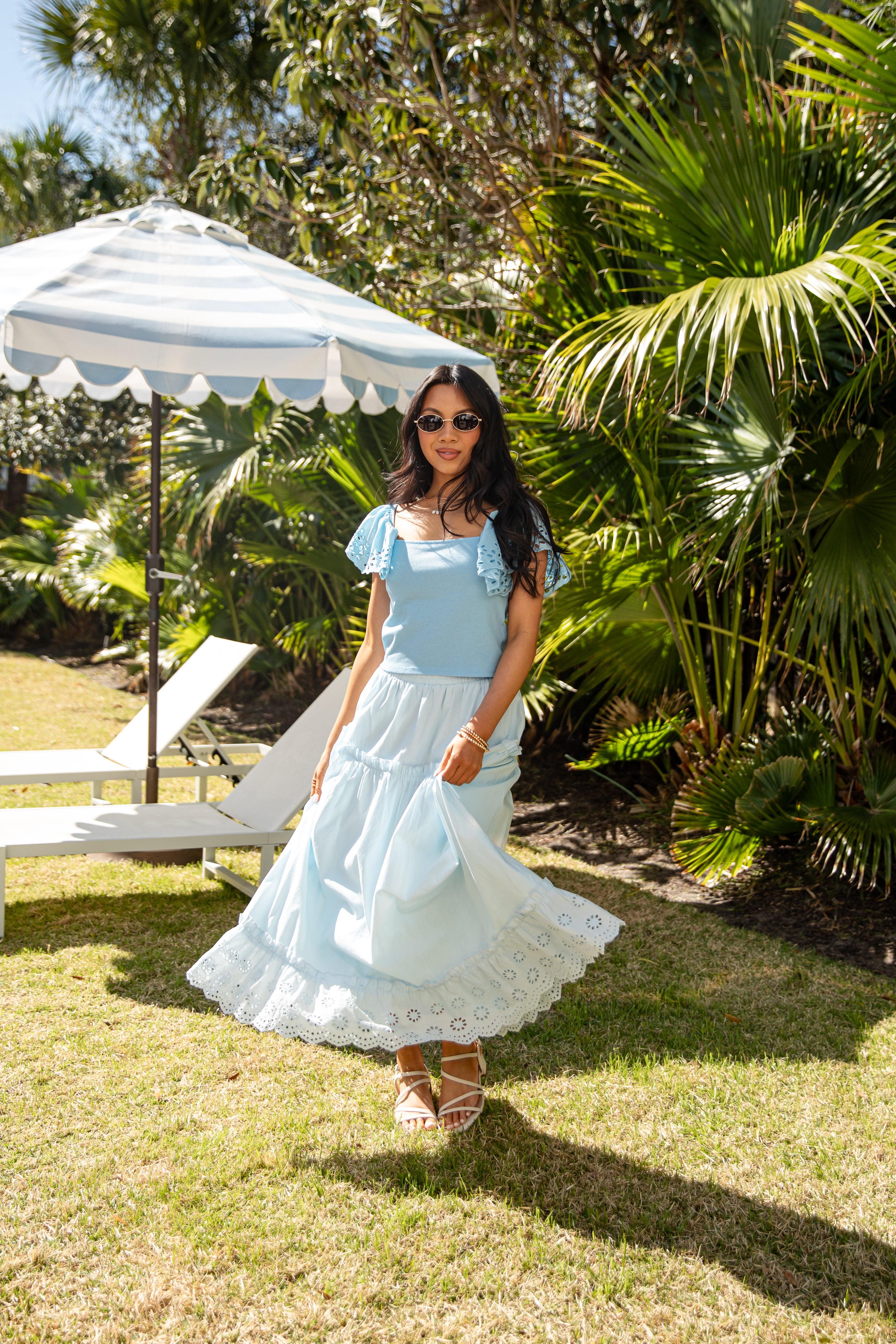 Light blue flowy maxi skirt twirling outdoors