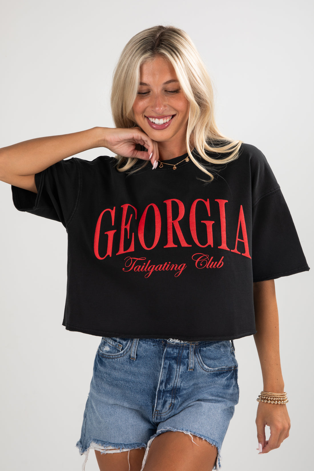 Woman wearing a black t-shirt with &