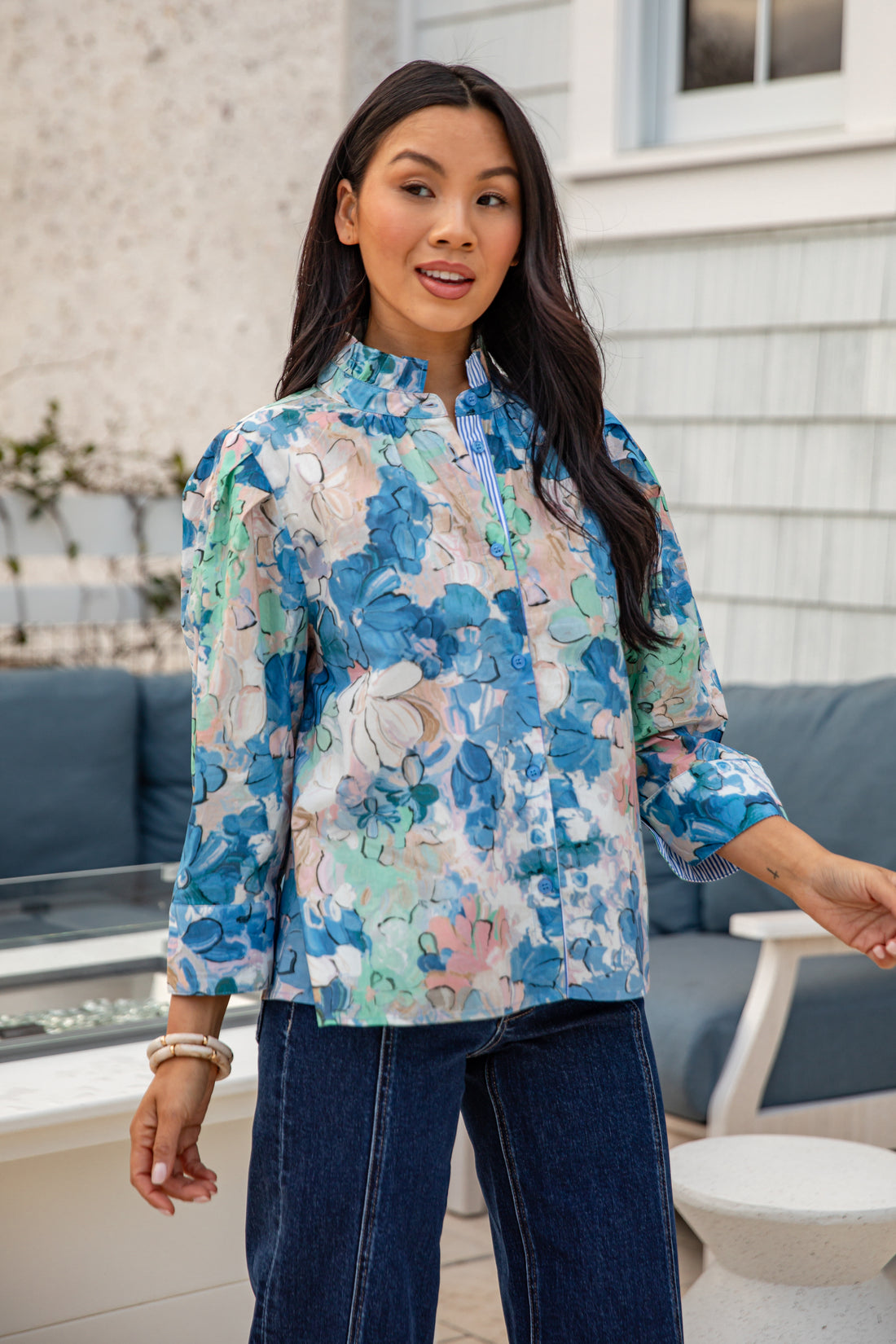 Woman wearing a floral blouse outdoors