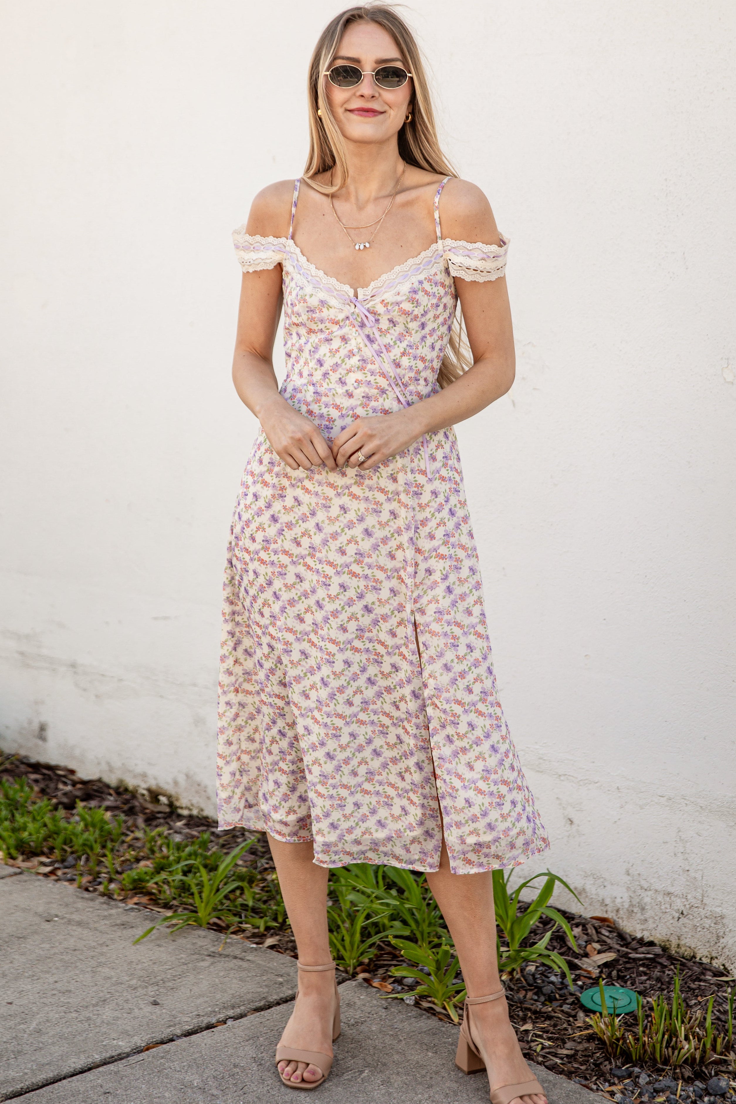 Floral dress with lace straps on a plain background