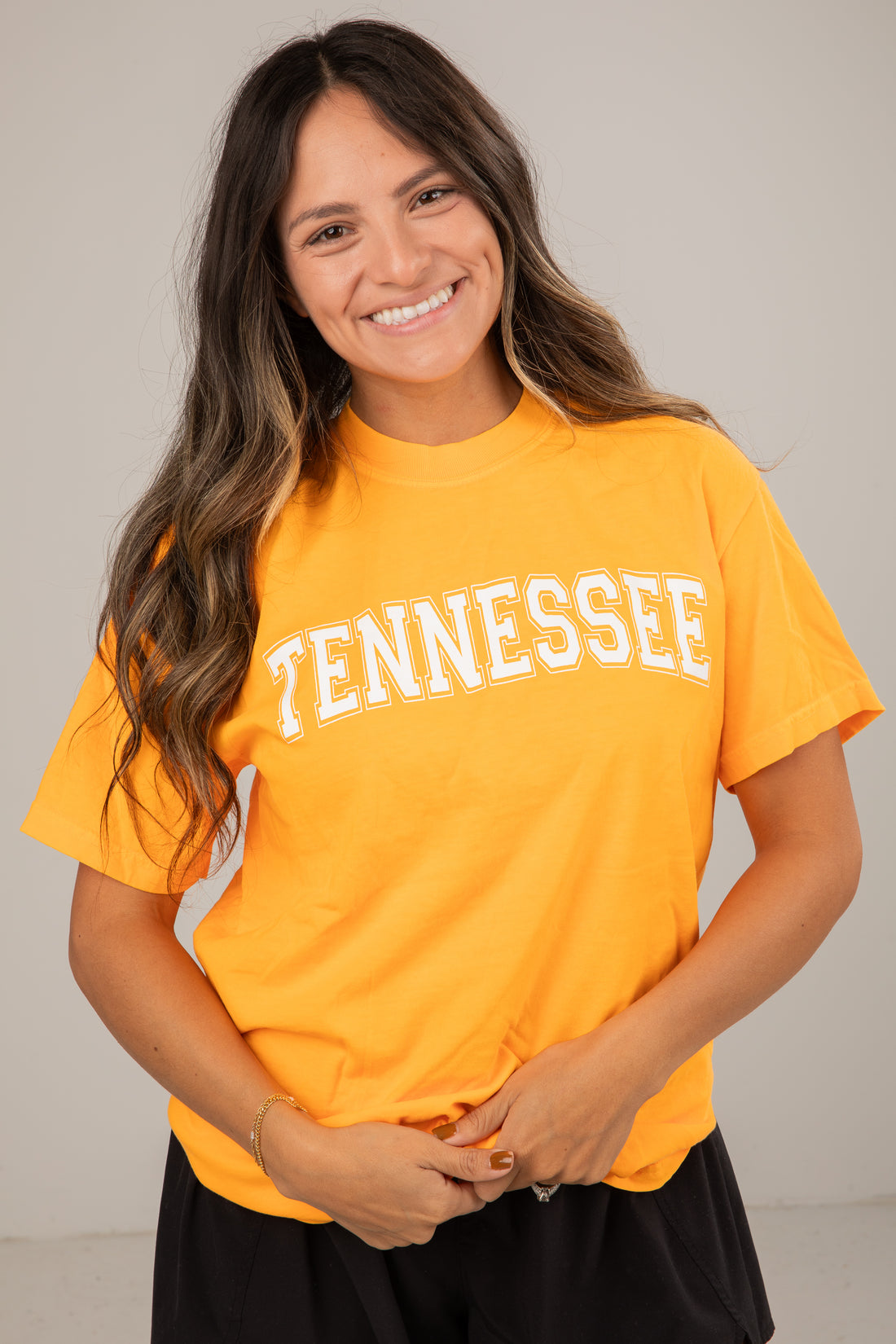 Woman wearing a yellow &