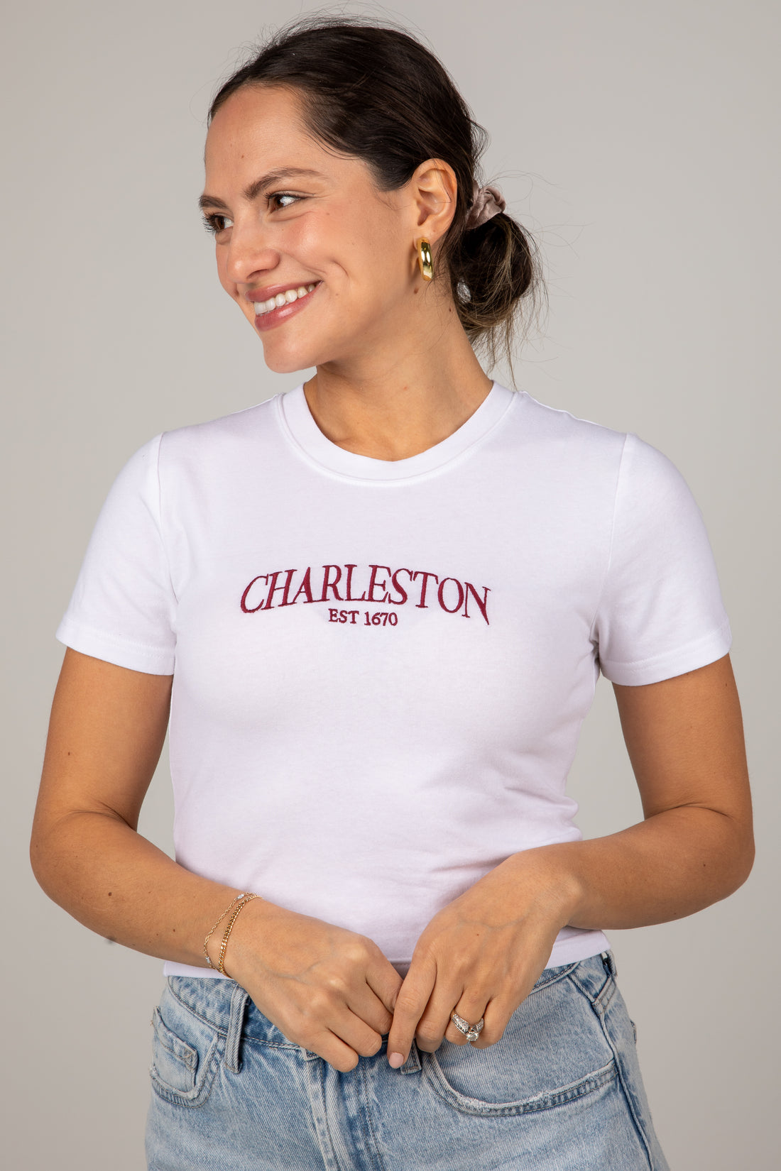 Woman wearing a white t-shirt with &