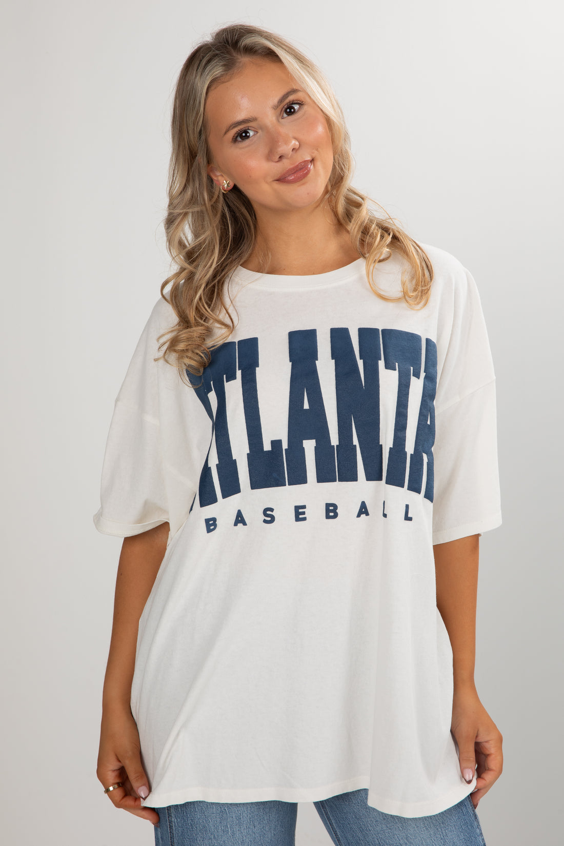 Woman wearing a white t-shirt with &