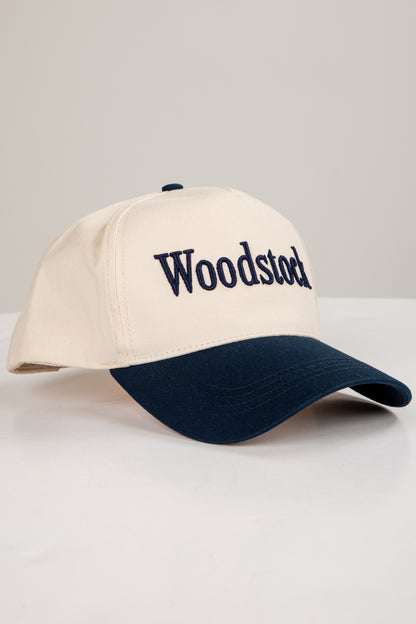 Beige and navy cap with &