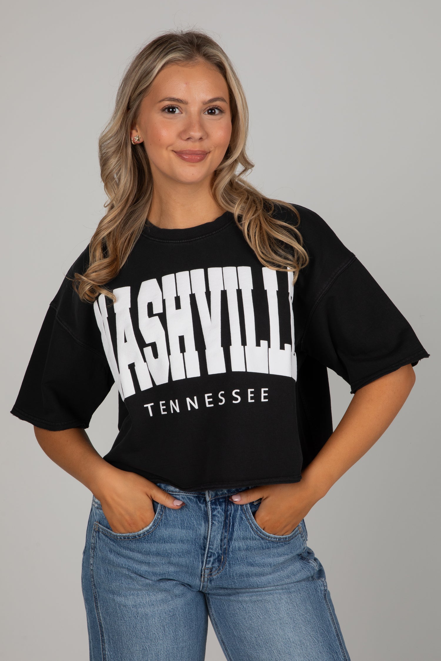 Woman wearing a black t-shirt with &