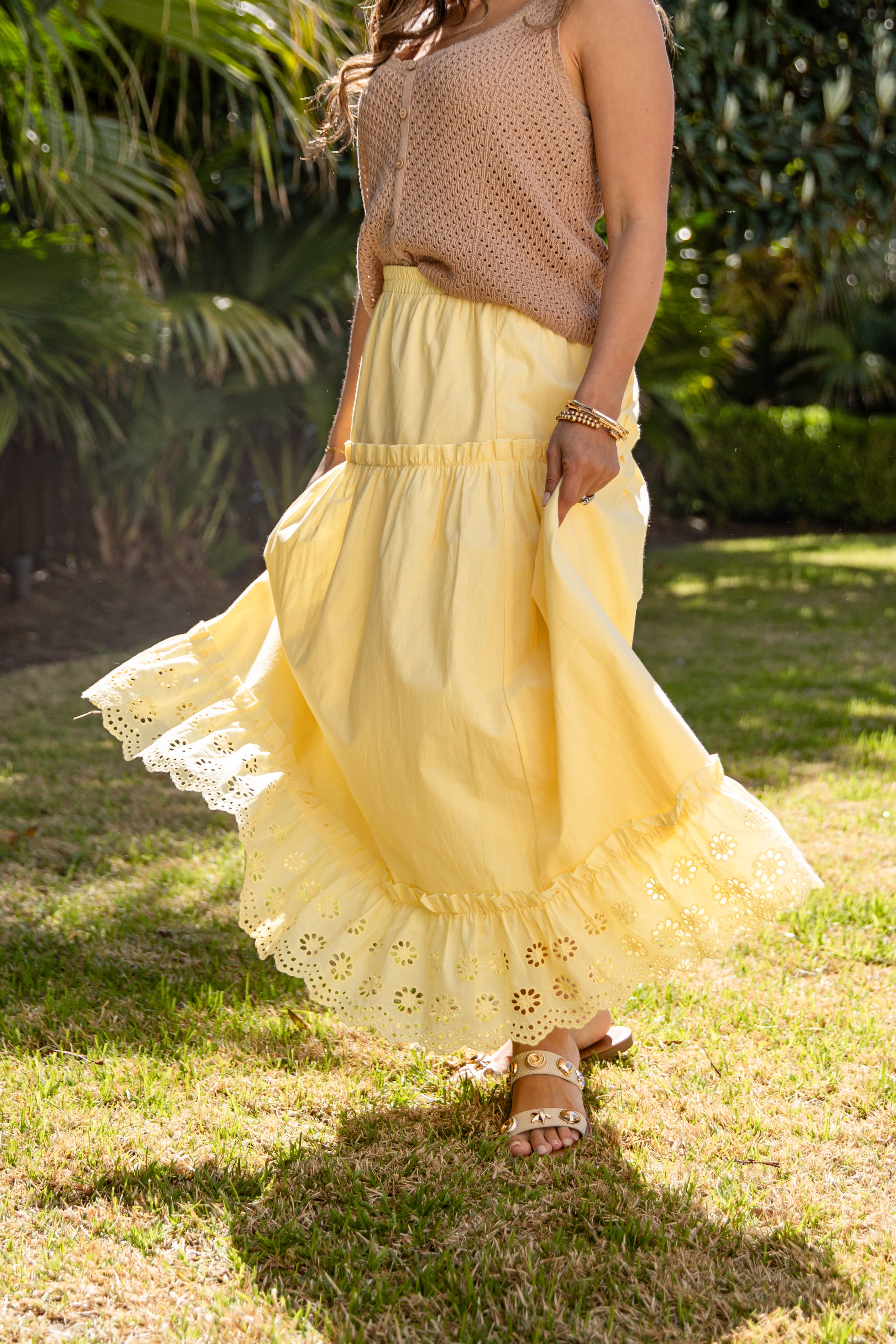 Yellow lace-trim maxi skirt styled in sun